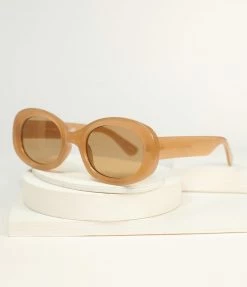 Lucent Product Inc. 1960s Brown Translucent Oval Sunglasses